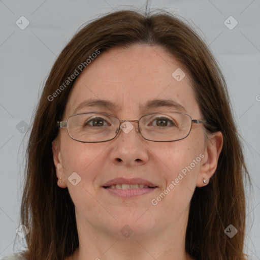 Joyful white adult female with long  brown hair and brown eyes