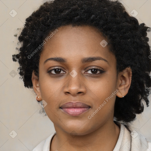 Joyful black young-adult female with long  black hair and brown eyes