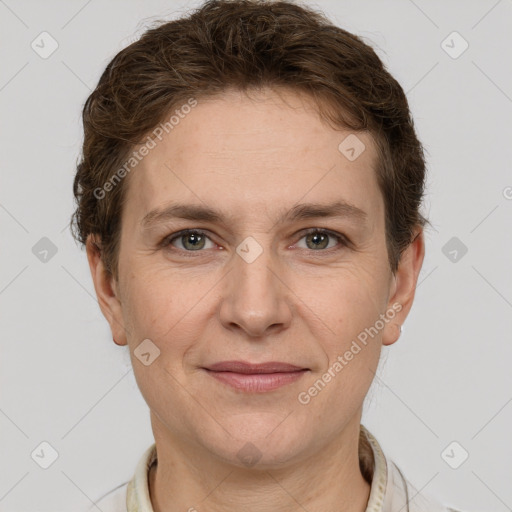 Joyful white adult female with short  brown hair and grey eyes