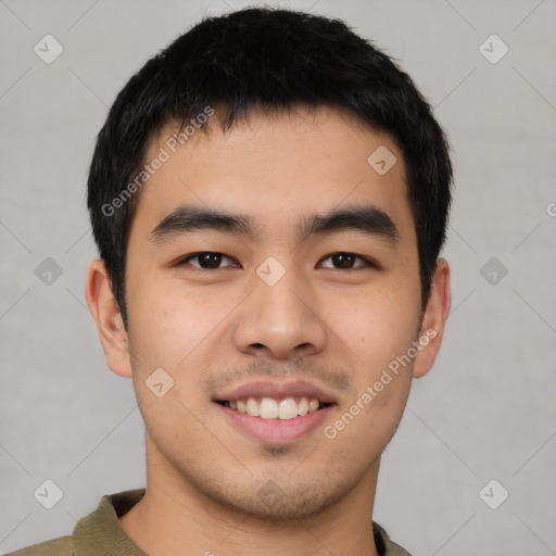 Joyful asian young-adult male with short  brown hair and brown eyes