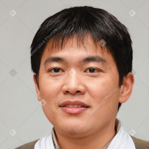 Joyful asian young-adult male with short  black hair and brown eyes