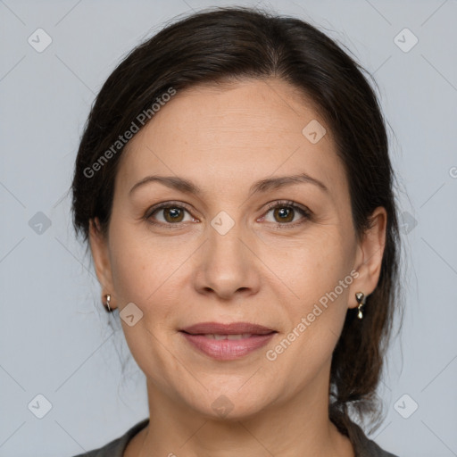 Joyful white adult female with medium  brown hair and brown eyes