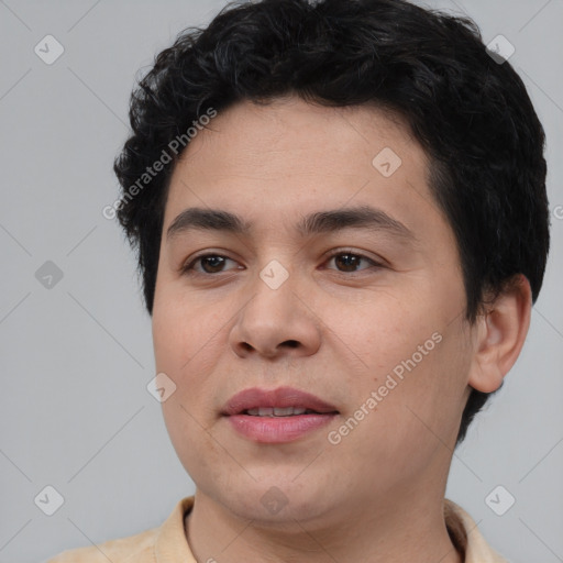 Joyful white young-adult male with short  black hair and brown eyes