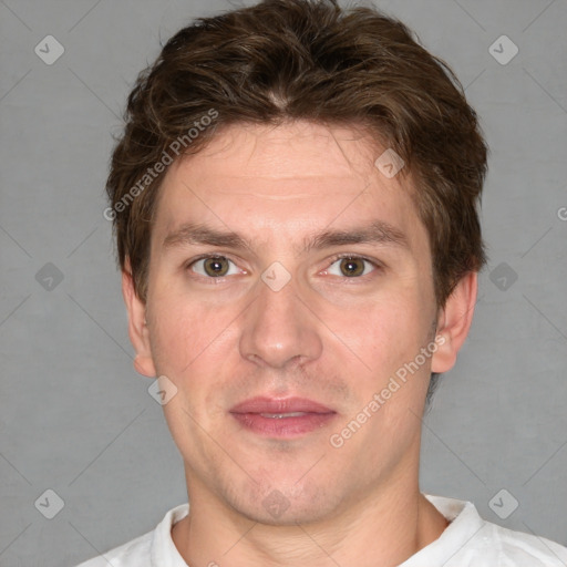 Joyful white adult male with short  brown hair and grey eyes