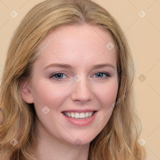 Joyful white young-adult female with long  brown hair and blue eyes