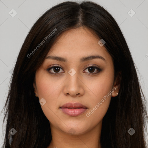 Joyful latino young-adult female with long  brown hair and brown eyes