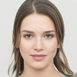 Joyful white young-adult female with medium  brown hair and green eyes