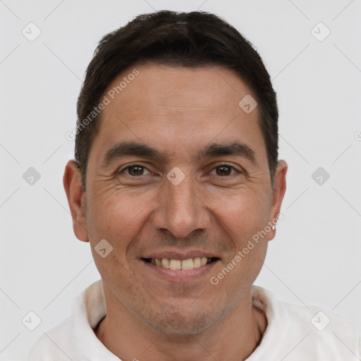 Joyful white adult male with short  brown hair and brown eyes