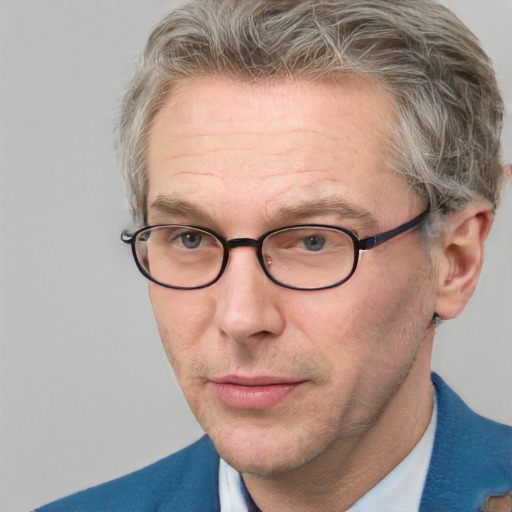 Neutral white middle-aged male with short  gray hair and blue eyes