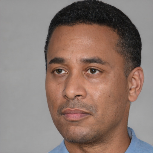 Neutral black adult male with short  black hair and brown eyes
