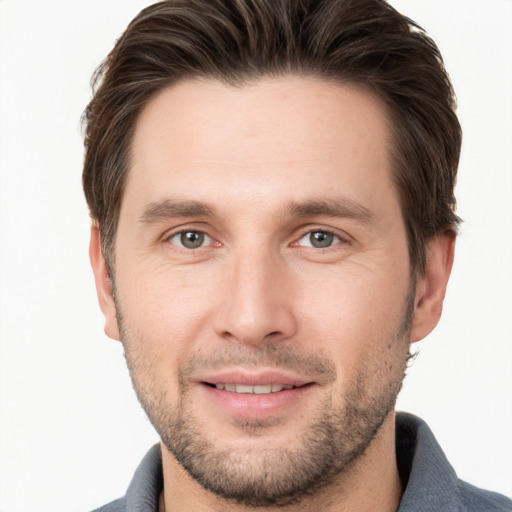 Joyful white young-adult male with short  brown hair and brown eyes