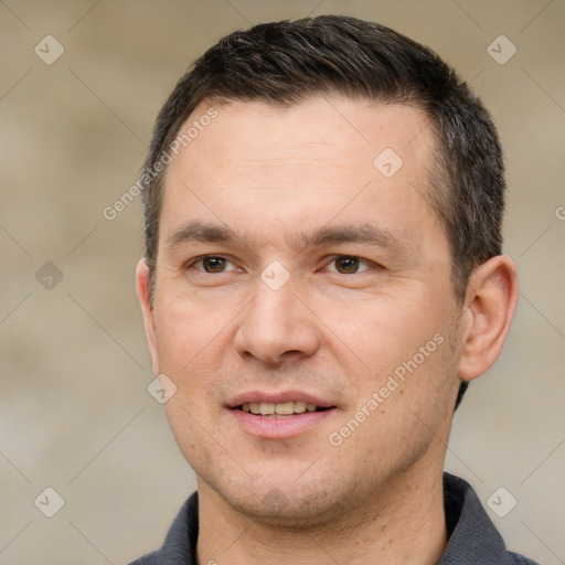 Joyful white adult male with short  brown hair and brown eyes