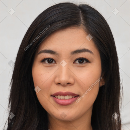 Joyful asian young-adult female with long  brown hair and brown eyes