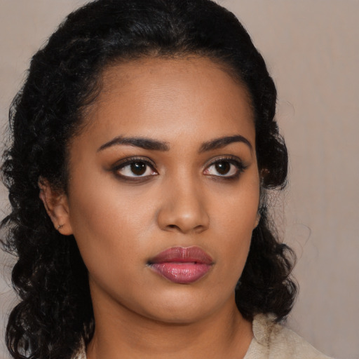 Neutral latino young-adult female with medium  black hair and brown eyes