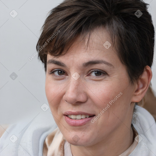 Joyful white adult female with short  brown hair and brown eyes