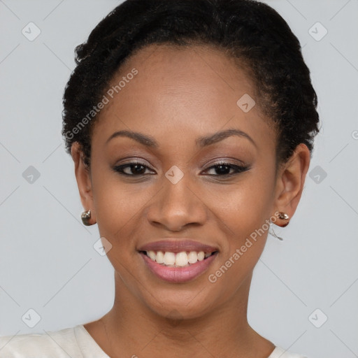 Joyful black young-adult female with short  brown hair and brown eyes