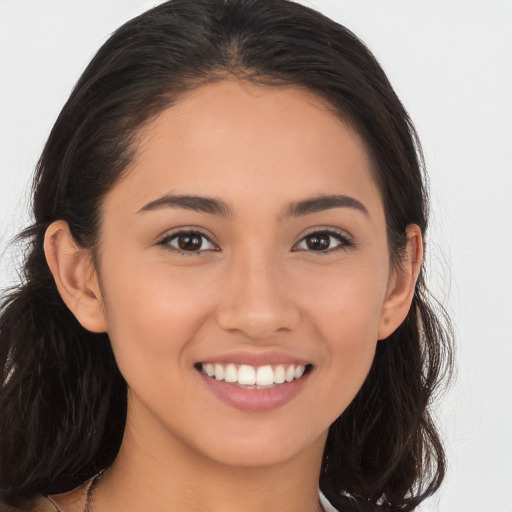 Joyful white young-adult female with long  brown hair and brown eyes