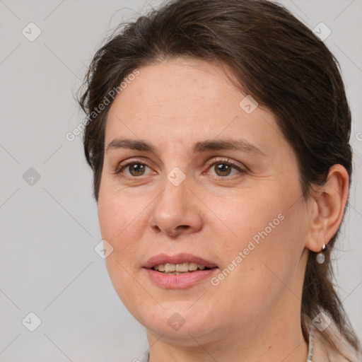 Joyful white adult female with medium  brown hair and brown eyes