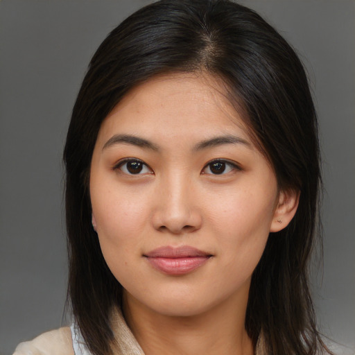 Joyful asian young-adult female with medium  brown hair and brown eyes