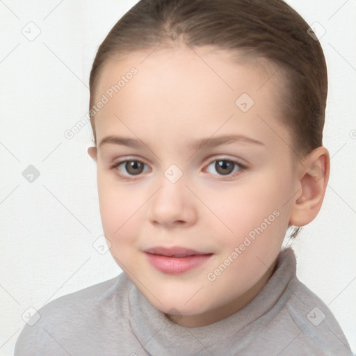 Joyful white child female with short  brown hair and brown eyes