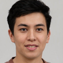 Joyful latino young-adult male with short  brown hair and brown eyes