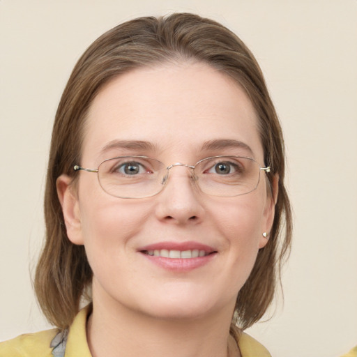 Joyful white young-adult female with medium  brown hair and blue eyes