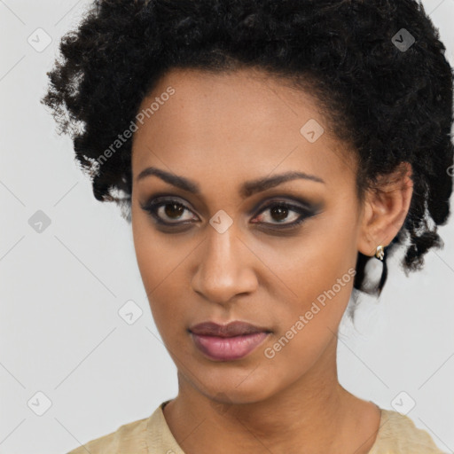 Joyful black young-adult female with long  brown hair and brown eyes