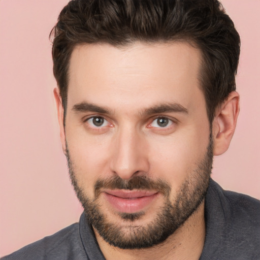 Joyful white young-adult male with short  brown hair and brown eyes