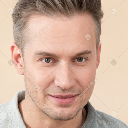 Joyful white adult male with short  brown hair and grey eyes