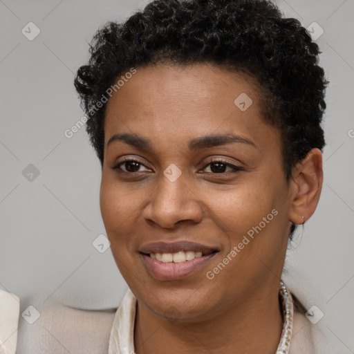 Joyful black young-adult female with short  brown hair and brown eyes