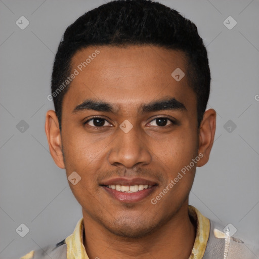 Joyful black young-adult male with short  black hair and brown eyes