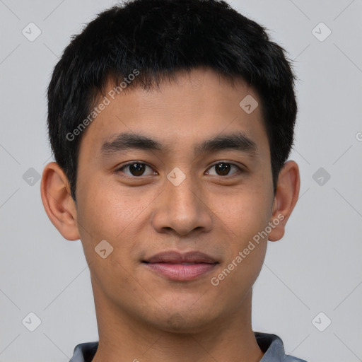 Joyful asian young-adult male with short  black hair and brown eyes