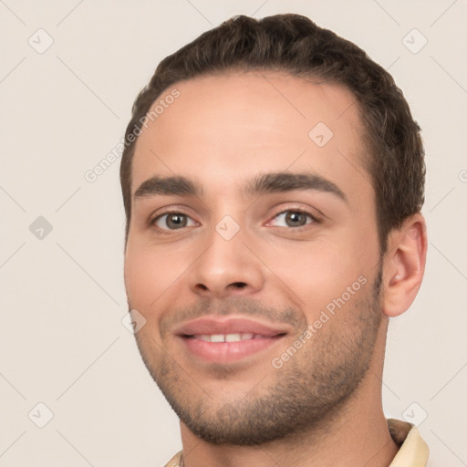 Joyful white young-adult male with short  brown hair and brown eyes