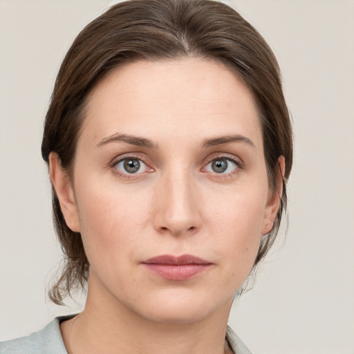 Neutral white young-adult female with medium  brown hair and grey eyes