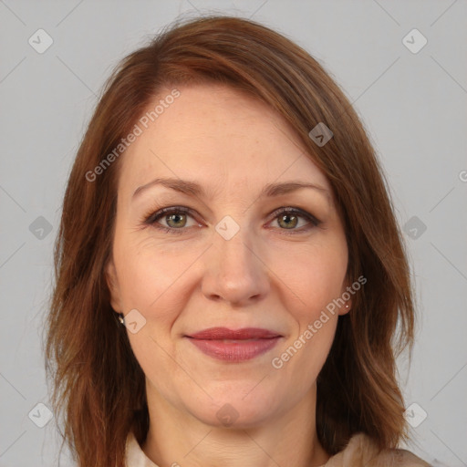 Joyful white adult female with medium  brown hair and brown eyes