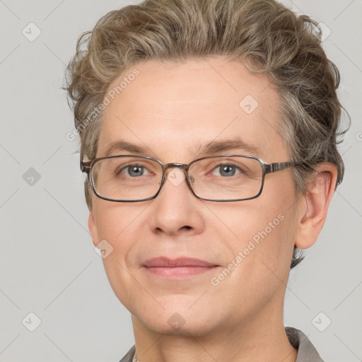 Joyful white adult male with short  brown hair and grey eyes