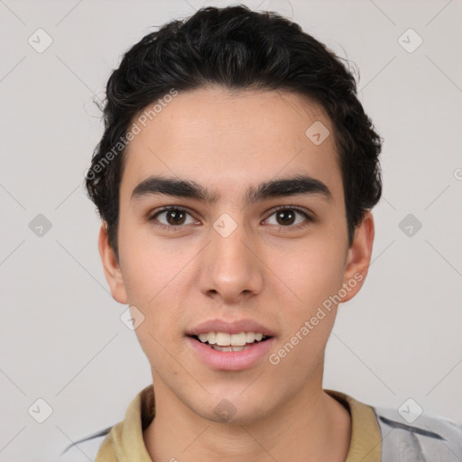 Joyful latino young-adult male with short  brown hair and brown eyes