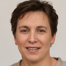 Joyful white adult female with short  brown hair and brown eyes