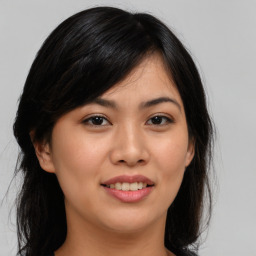 Joyful asian young-adult female with medium  black hair and brown eyes