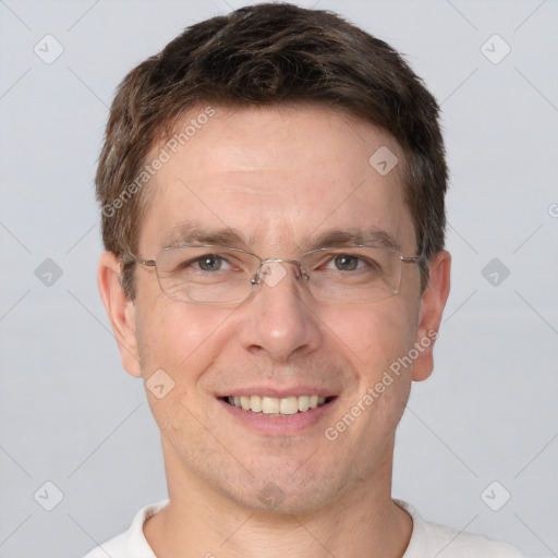 Joyful white adult male with short  brown hair and brown eyes