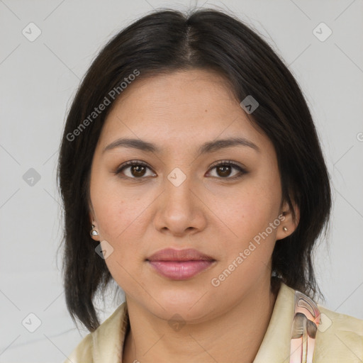 Joyful latino young-adult female with medium  brown hair and brown eyes