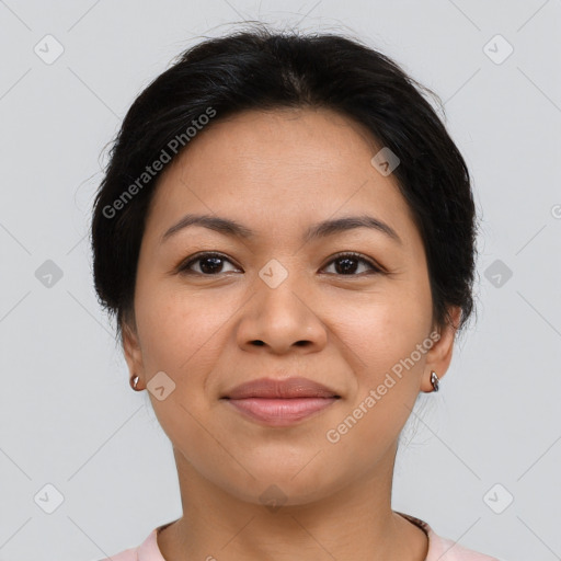 Joyful latino young-adult female with short  brown hair and brown eyes