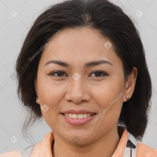 Joyful latino young-adult female with medium  brown hair and brown eyes