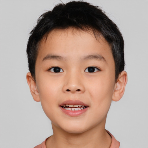 Joyful asian child male with short  brown hair and brown eyes