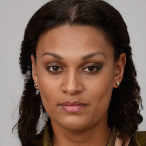 Neutral black young-adult female with long  brown hair and brown eyes