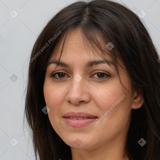 Joyful white adult female with long  brown hair and brown eyes