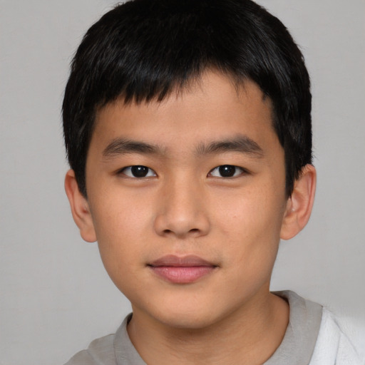 Neutral asian child male with short  brown hair and brown eyes