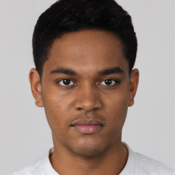 Neutral black young-adult male with short  black hair and brown eyes