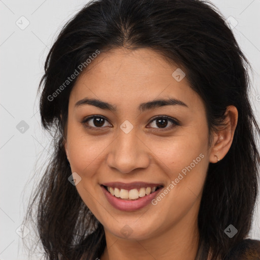 Joyful latino young-adult female with long  brown hair and brown eyes