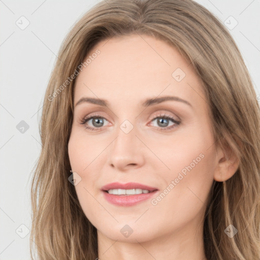 Joyful white young-adult female with long  brown hair and blue eyes